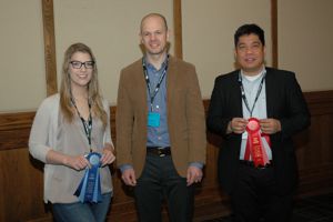 2018 winners Danilo Sotto, University of Saskatchewan, (right) and Jill Hugman, University of Alberta with presenter Dr. Ben Willing of U of A, center.