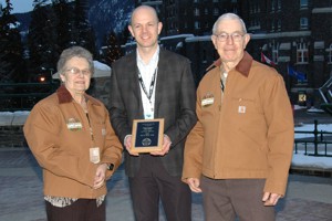 Carl  and Carolyn Israel of Carl Israel Farms Ltd. in Mapleton Twp., Ont. With Dr. Ben Willing, center), University of Alberta.