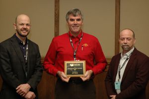 Ben Willing, (left), Jack Dekkers (center) and award present Michael Dyck. 