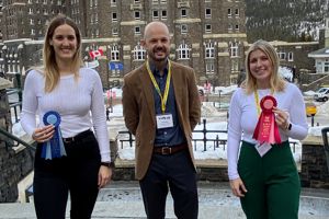 Alison Jeffery (Rght) Ben Willing awards Chair, center and  Carley Camire (left).